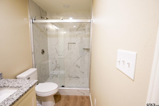 1370 Fm 315, Palestine, TX 75801 - bathroom featuring vanity, toilet, a marble finish shower, and wood finished floors