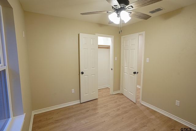 1370 Fm 315, Palestine, TX 75801 - unfurnished bedroom featuring light wood-type flooring, baseboards, a ceiling fan, and a closet