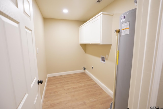 1370 Fm 315, Palestine, TX 75801 - laundry room featuring washer hookup, light wood-style floors, recessed lighting, cabinet space, and baseboards