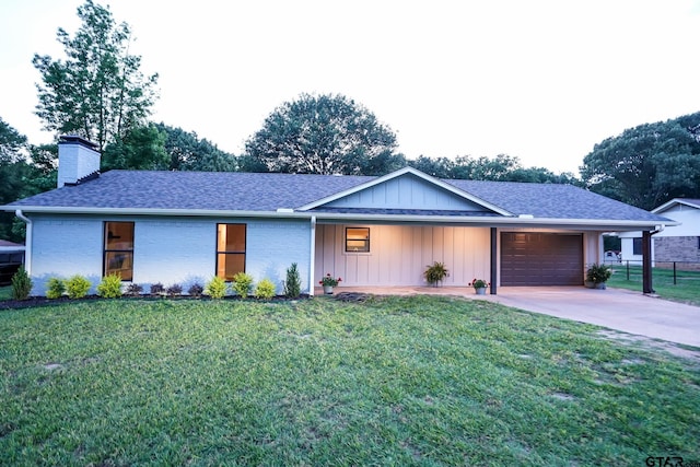 1370 Fm 315, Palestine, TX 75801 - view of front of home with an attached garage, board and batten siding, driveway, a chimney, and roof with shingles