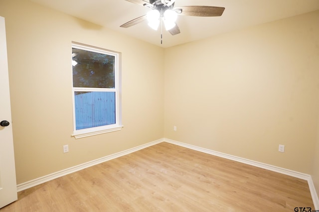 1370 Fm 315, Palestine, TX 75801 - spare room featuring light wood-style floors, a ceiling fan, and baseboards