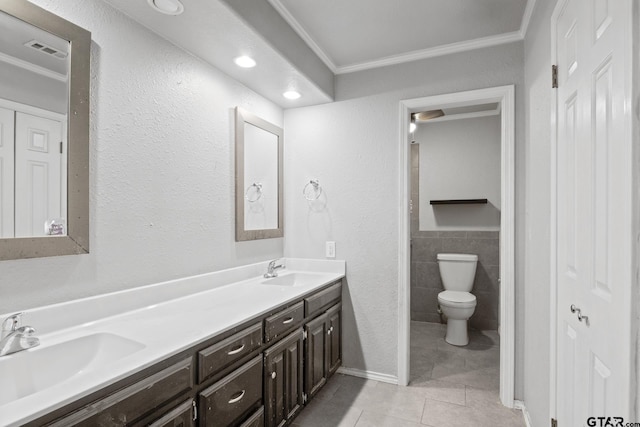 full bath with a sink, tile patterned floors, and crown molding