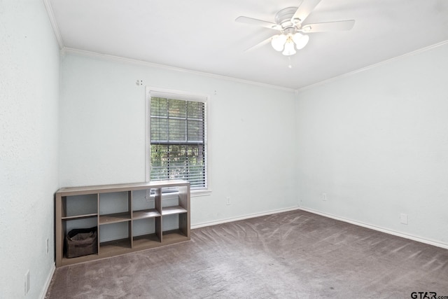 carpeted spare room featuring baseboards, crown molding, and ceiling fan