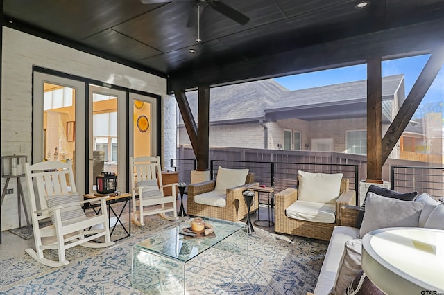 sunroom / solarium with ceiling fan