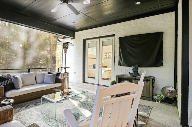 exterior space with an outdoor living space, ceiling fan, and french doors