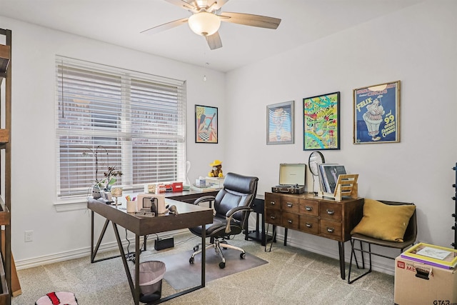 office area featuring light colored carpet and ceiling fan