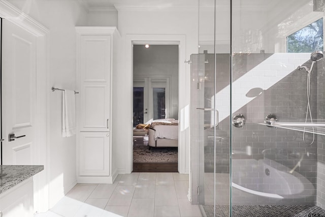 bathroom featuring tile patterned floors, an enclosed shower, and ornamental molding