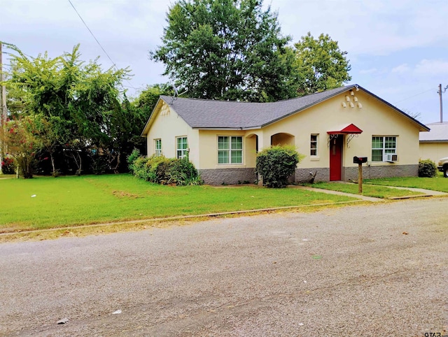 single story home with a front lawn and cooling unit