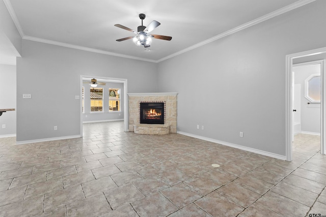 unfurnished living room with ceiling fan, a stone fireplace, and crown molding