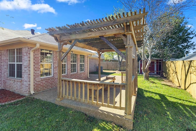 wooden deck with a pergola, a lawn, and a shed