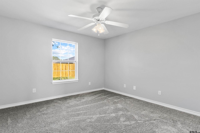 unfurnished room with ceiling fan and carpet floors