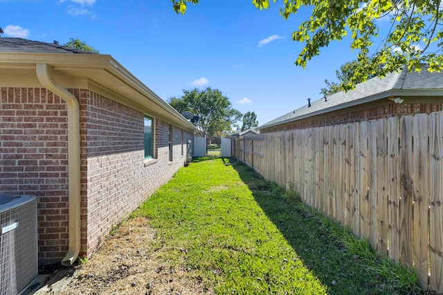 view of yard featuring central AC unit