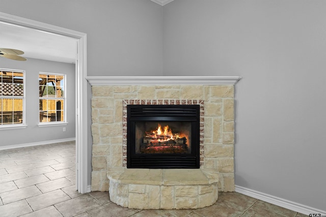 details featuring a stone fireplace, tile patterned floors, and crown molding