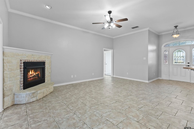 unfurnished living room with a fireplace, ceiling fan, crown molding, and light tile patterned floors