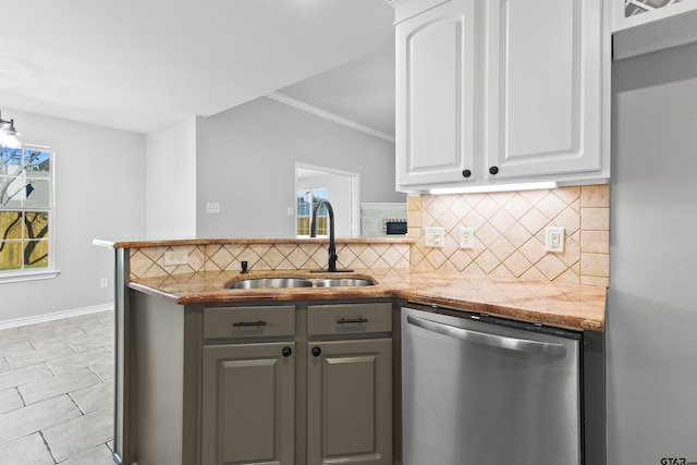 kitchen with dishwasher, white cabinets, sink, gray cabinetry, and dark stone countertops