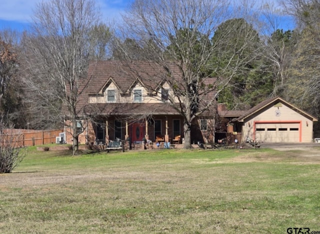 cape cod house featuring a garage, driveway, fence, a front lawn, and a porch