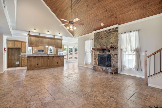 22886 County Road 422, Lindale, TX 75771 - unfurnished living room with high vaulted ceiling, wooden ceiling, a ceiling fan, a stone fireplace, and stairs