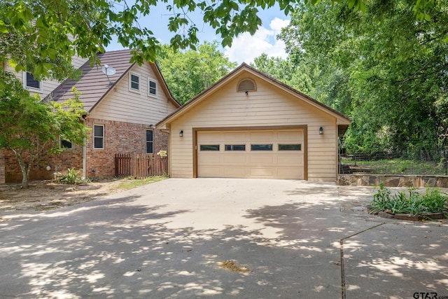 22886 County Road 422, Lindale, TX 75771 - view of front of house with an outdoor structure, driveway, brick siding, and a detached garage