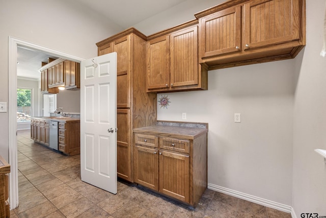 22886 County Road 422, Lindale, TX 75771 - kitchen with dishwashing machine and brown cabinetry