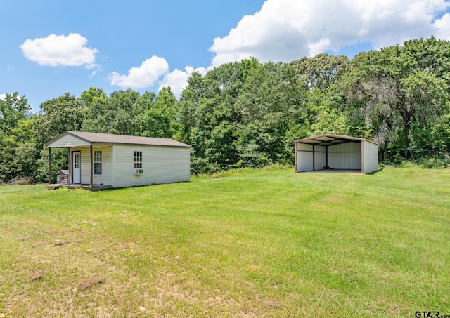 22886 County Road 422, Lindale, TX 75771 - view of grassy yard with a detached carport and an outbuilding