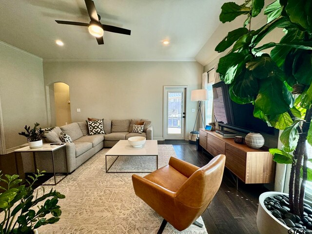 living room with ceiling fan, dark hardwood / wood-style flooring, and crown molding