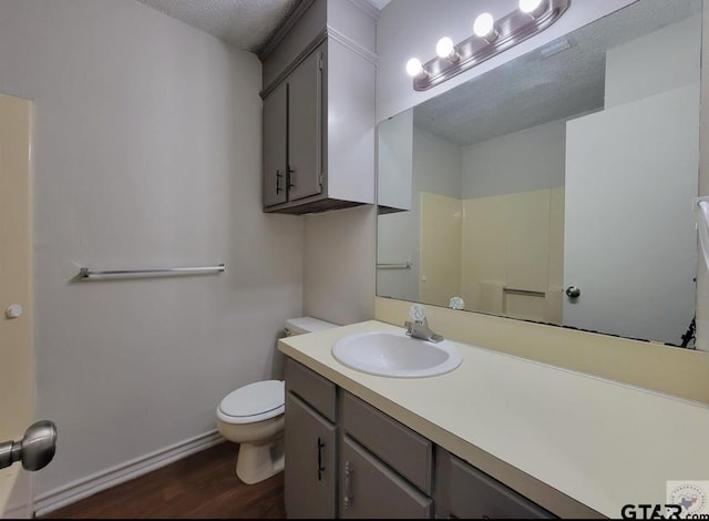 2A Robin Dr, Texarkana, TX 75503 - full bath with vanity, wood finished floors, and a textured ceiling