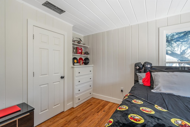 bedroom featuring light wood-type flooring and visible vents