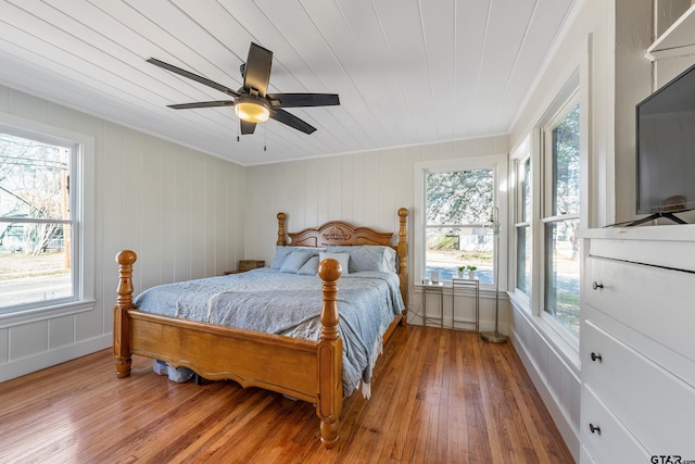 bedroom with wood finished floors and a ceiling fan