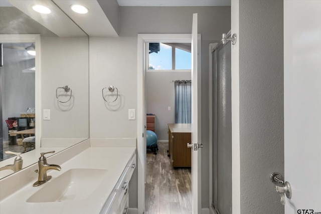 924 Bradley Dr, Athens, TX 75751 - full bathroom with a stall shower, recessed lighting, ensuite bath, vanity, and wood finished floors
