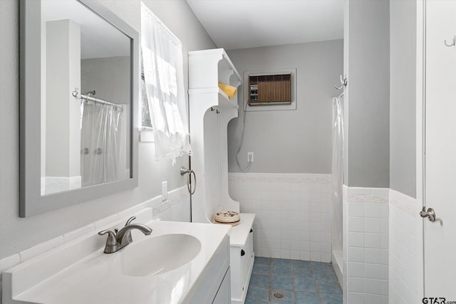 924 Bradley Dr, Athens, TX 75751 - full bathroom with a wall unit AC, tile patterned floors, tile walls, curtained shower, and vanity