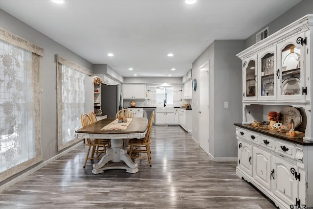 924 Bradley Dr, Athens, TX 75751 - dining area featuring visible vents, wood finished floors, baseboards, and recessed lighting