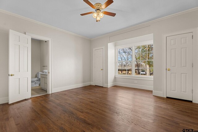 unfurnished bedroom featuring crown molding, dark hardwood / wood-style floors, connected bathroom, and ceiling fan