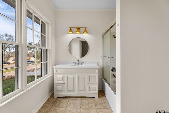 bathroom with ornamental molding, combined bath / shower with glass door, vanity, and tile patterned floors