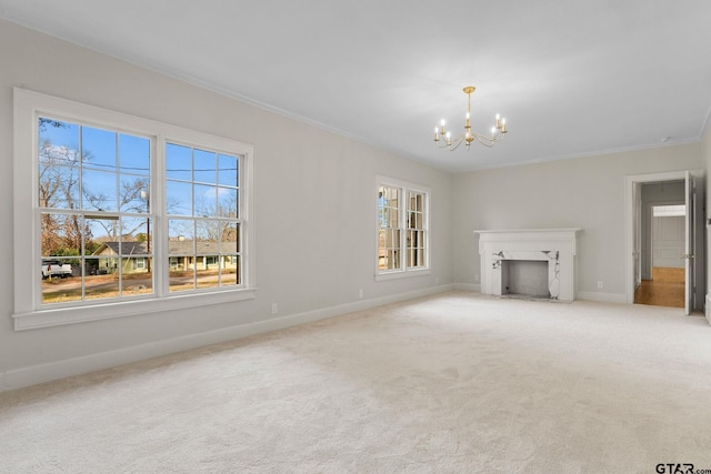 unfurnished living room featuring ornamental molding, carpet, a wealth of natural light, and a chandelier