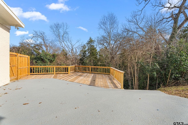 wooden terrace featuring a patio area