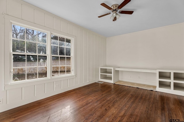 unfurnished living room featuring hardwood / wood-style flooring and ceiling fan