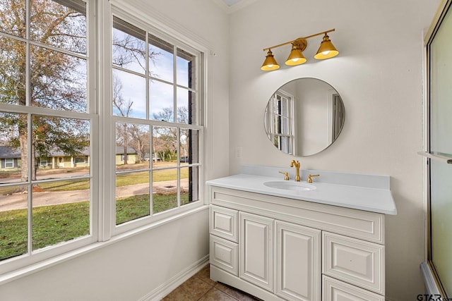 bathroom featuring tile patterned flooring and vanity