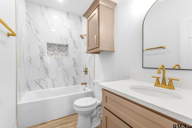 bathroom with vanity, shower / tub combination, toilet, and wood finished floors