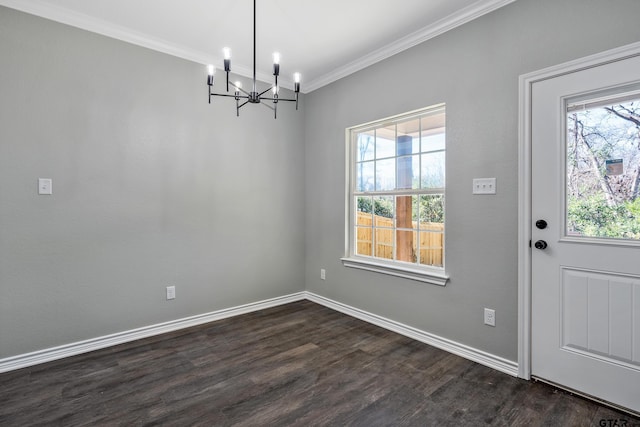 unfurnished dining area with crown molding, dark wood-type flooring, and a notable chandelier