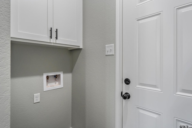 laundry room with cabinets and washer hookup