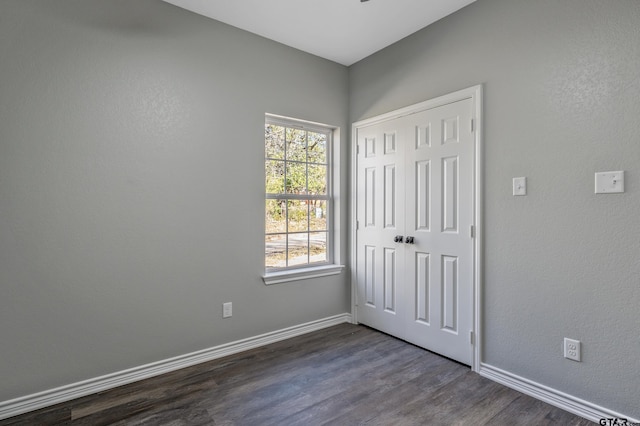 spare room featuring dark hardwood / wood-style floors