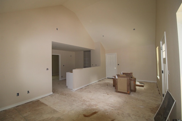 16954 Deer Run Rd, Flint, TX 75762 - unfurnished living room with high vaulted ceiling and baseboards