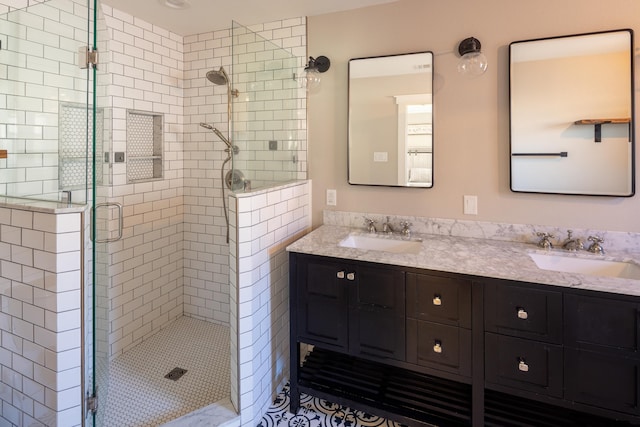 bathroom with vanity and a shower with door