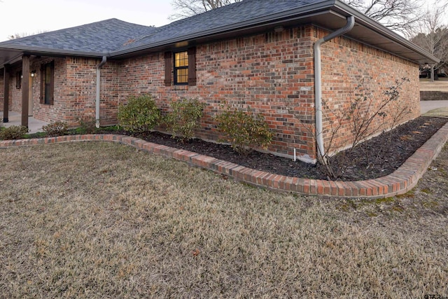 view of property exterior featuring a lawn