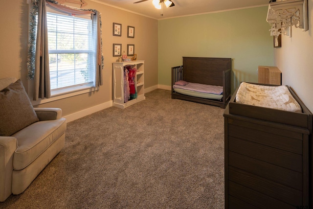 carpeted bedroom with ceiling fan and ornamental molding