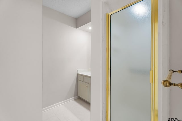 bathroom featuring vanity and a shower with shower door