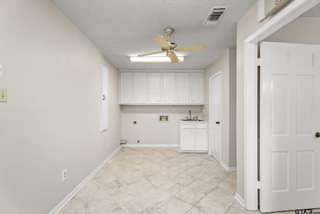 clothes washing area featuring ceiling fan, sink, cabinets, washer hookup, and electric dryer hookup