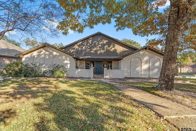 ranch-style home with a front lawn