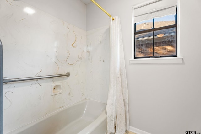 bathroom with shower / bathtub combination with curtain