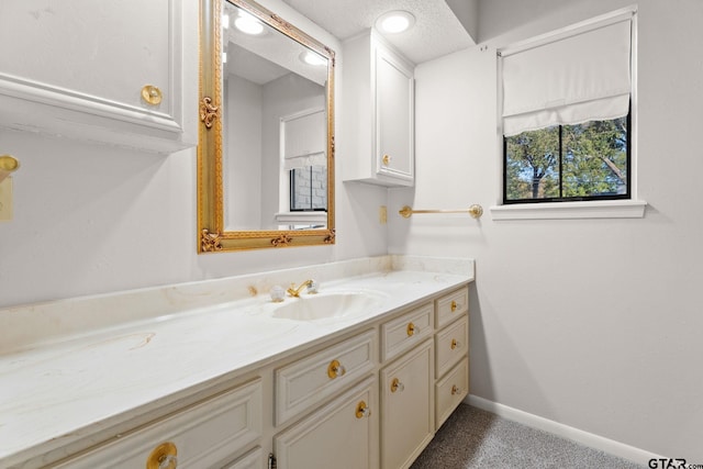 bathroom featuring vanity and a textured ceiling